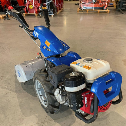 Begagnad BCS 728 tvåhjulstraktor i sidovy med monterad jordfräs 66 cm
