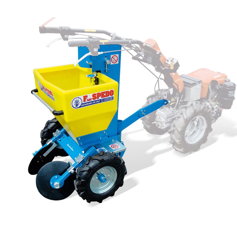 Enradig F.lli Spedo potatissättare med gul behållare monterad på en tvåhjulstraktor.
